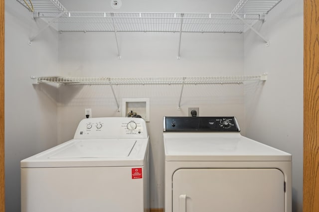 washroom featuring laundry area and washing machine and dryer