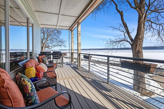 wooden deck featuring a water view