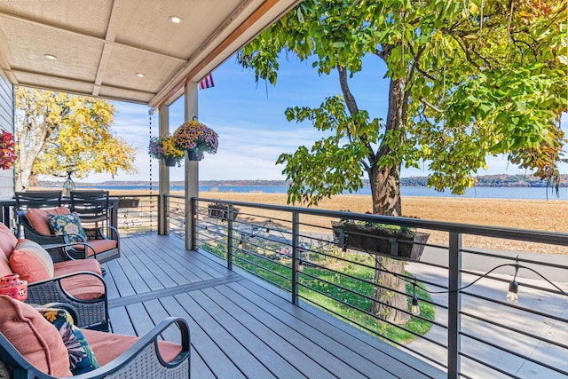 wooden terrace with a water view