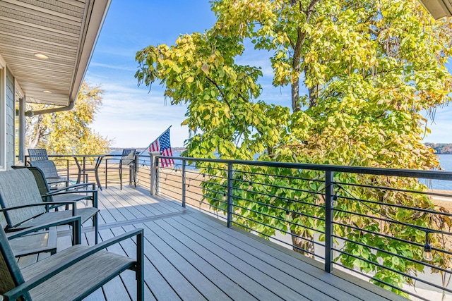 wooden deck featuring a water view