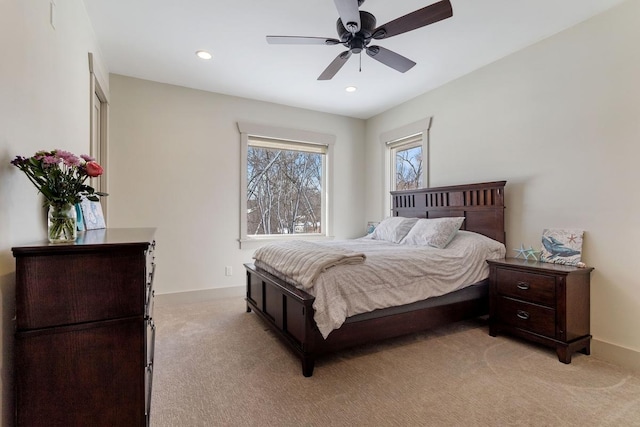 bedroom with light carpet, baseboards, recessed lighting, and ceiling fan