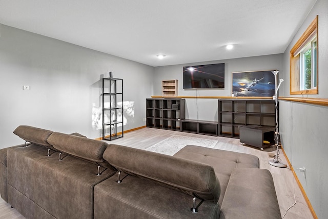 living room with baseboards and wood finished floors