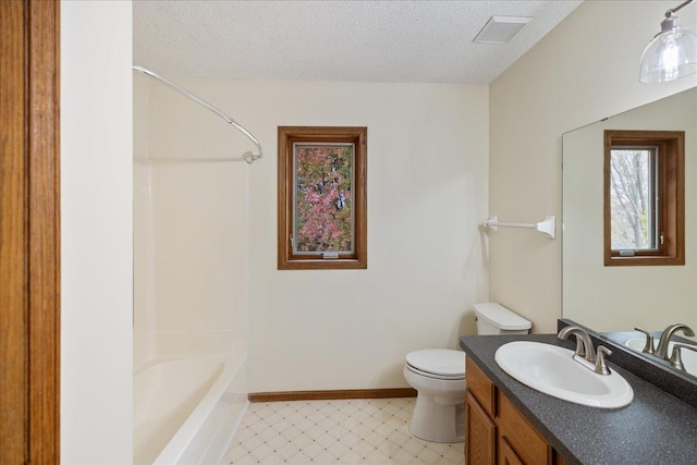 bathroom featuring baseboards, visible vents, toilet, a textured ceiling, and vanity