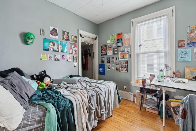 bedroom with wood-type flooring