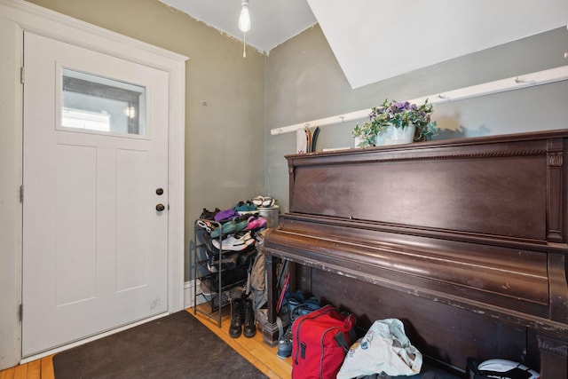 entryway with wood finished floors