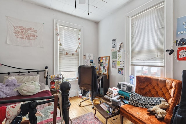 bedroom featuring light wood-style floors and multiple windows