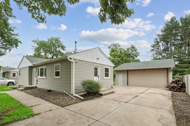 8527 10th Ave S, Bloomington, MN 55420 - view of home's exterior featuring an outbuilding, a garage, board and batten siding, and roof with shingles