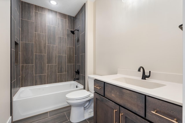 full bathroom featuring shower / washtub combination, vanity, and toilet