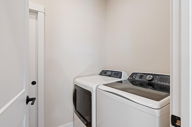 washroom with laundry area and independent washer and dryer