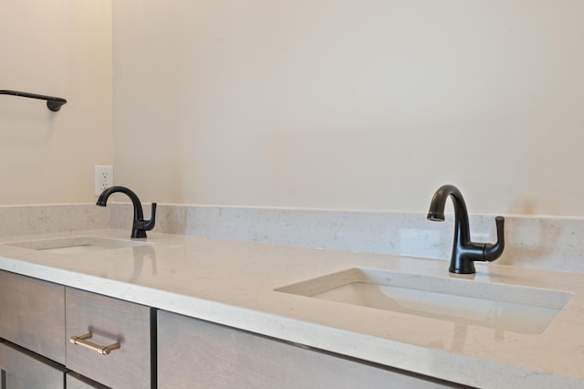 bathroom with double vanity and a sink