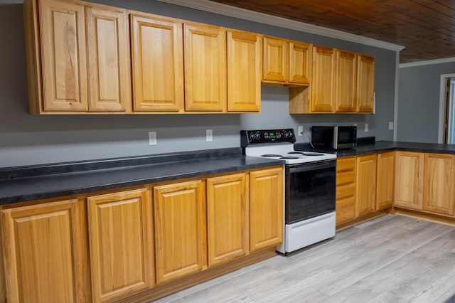 kitchen with dark countertops, black microwave, crown molding, and range with electric stovetop