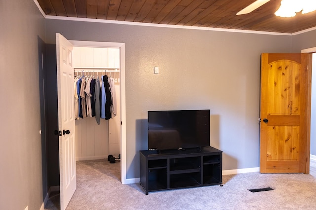 bedroom with wood ceiling, carpet, visible vents, and crown molding