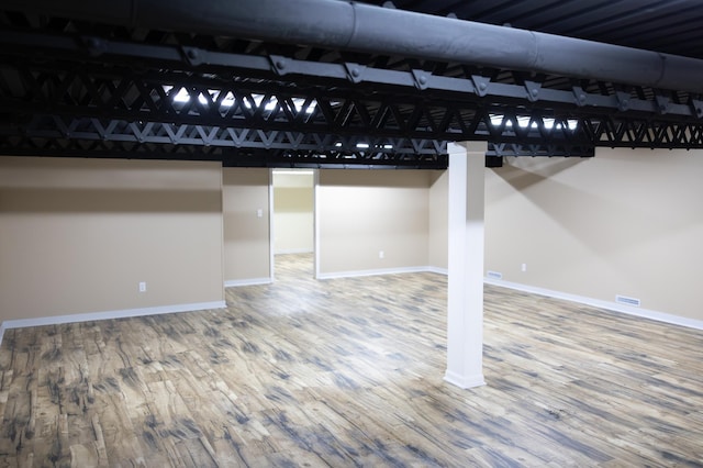 basement with wood finished floors and baseboards