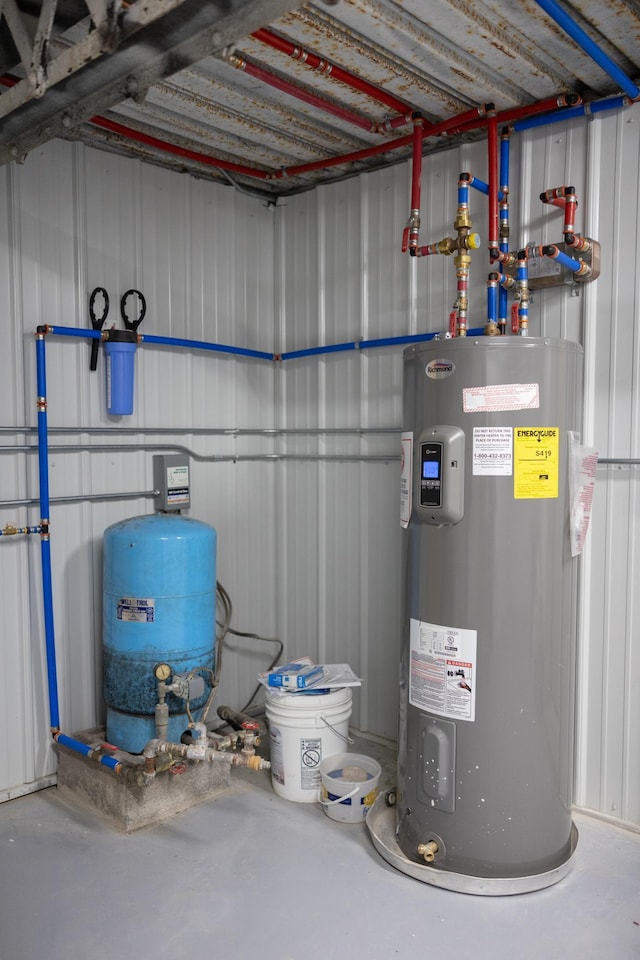 utilities with water heater and a garage