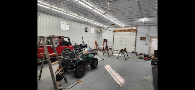 garage with a wall mounted AC and metal wall