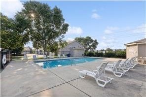 pool featuring a patio and fence