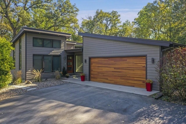 modern home with an attached garage and driveway