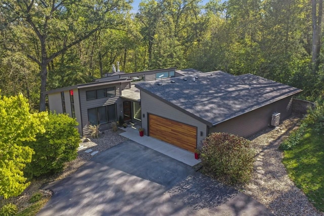 birds eye view of property with a wooded view