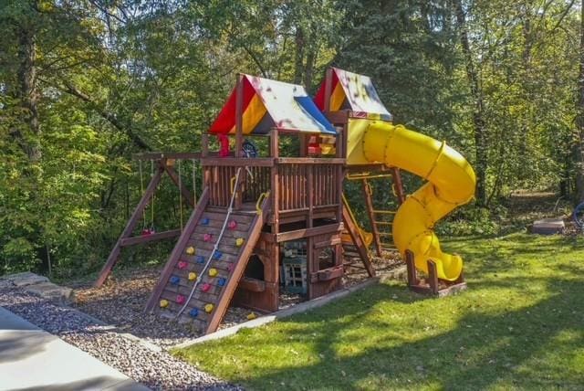 view of playground with a lawn