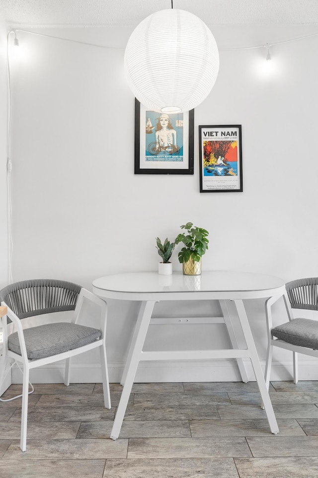 dining space with wood tiled floor