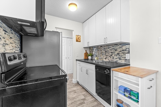 kitchen with wood tiled floor, stainless steel electric range, a sink, white cabinets, and dishwasher