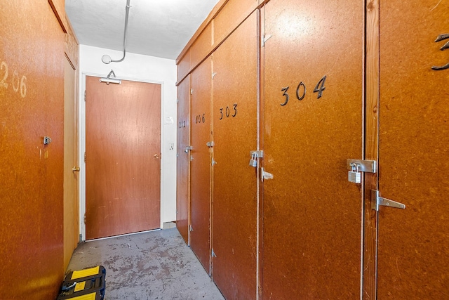 hallway featuring concrete floors