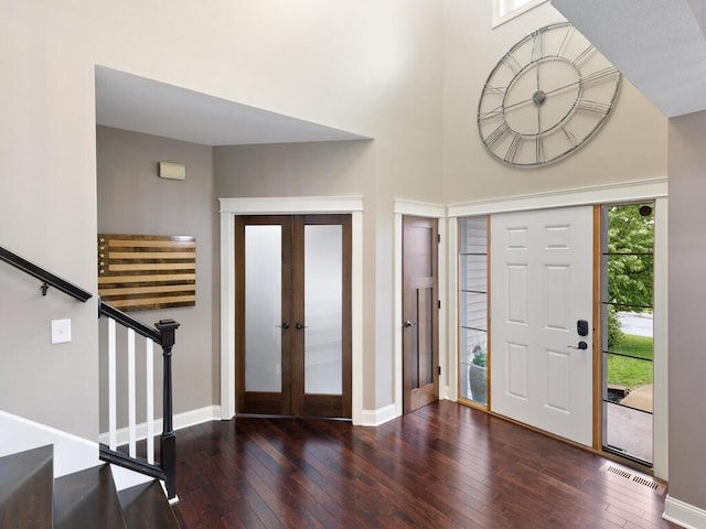 1757 Sandbar Cir, Waconia, MN 55387 - foyer entrance with french doors, hardwood / wood-style floors, stairs, baseboards, and a towering ceiling