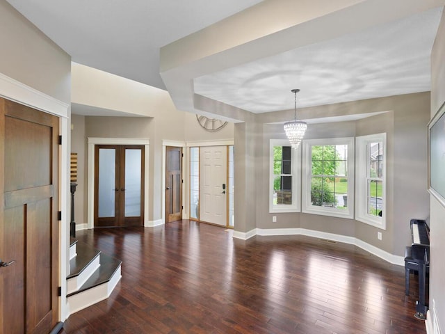 1757 Sandbar Cir, Waconia, MN 55387 - foyer featuring a chandelier, french doors, baseboards, and dark wood finished floors