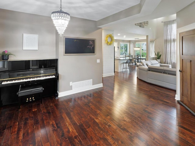 1757 Sandbar Cir, Waconia, MN 55387 - living area featuring a chandelier, hardwood / wood-style floors, and baseboards