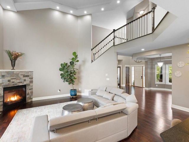 1757 Sandbar Cir, Waconia, MN 55387 - living room with wood finished floors, a towering ceiling, recessed lighting, baseboards, and a stone fireplace