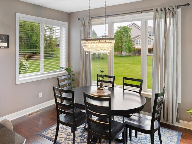 1757 Sandbar Cir, Waconia, MN 55387 - dining room with baseboards, plenty of natural light, dark wood finished floors, and a chandelier