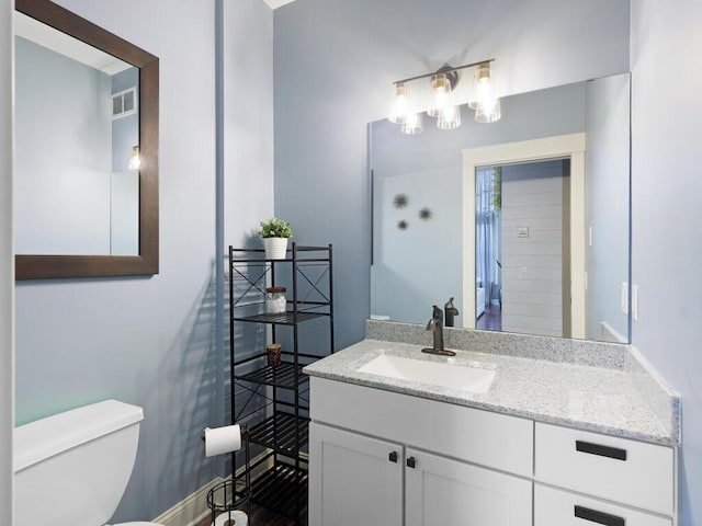 1757 Sandbar Cir, Waconia, MN 55387 - bathroom featuring toilet, vanity, and baseboards