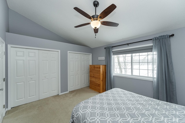 1868 Tiffany Cove Ln SW, Rochester, MN 55902 - carpeted bedroom with two closets, lofted ceiling, and a ceiling fan