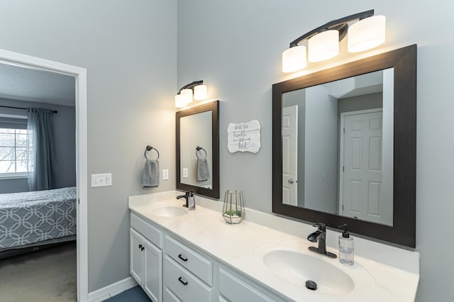 1868 Tiffany Cove Ln SW, Rochester, MN 55902 - full bathroom with double vanity, baseboards, and connected bathroom
