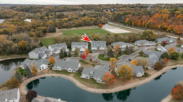 1868 Tiffany Cove Ln SW, Rochester, MN 55902 - aerial overview of property's location with a heavily wooded area, a nearby body of water, and nearby suburban area