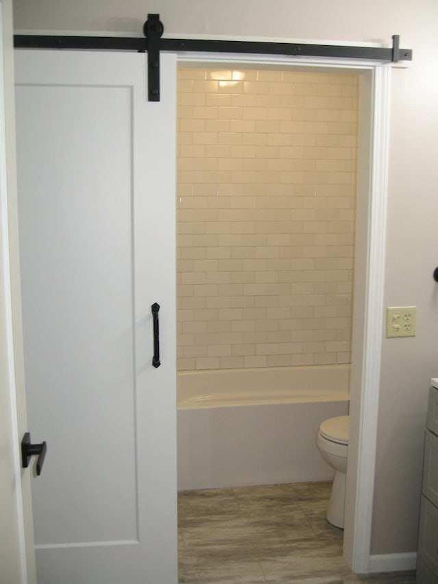 bathroom with shower / washtub combination, vanity, and toilet