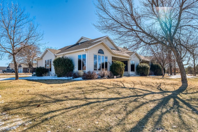 view of home's exterior featuring a yard