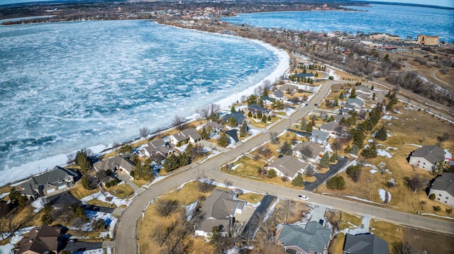 bird's eye view featuring a water view and a residential view