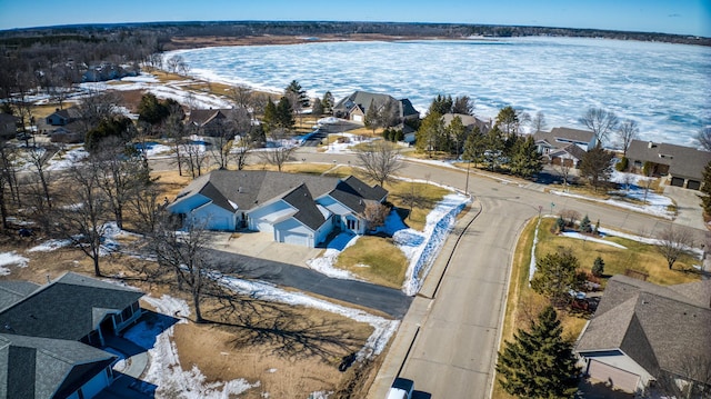 birds eye view of property featuring a water view and a residential view