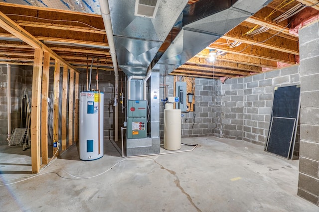 unfinished below grade area featuring water heater, visible vents, and heating unit