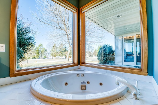 bathroom featuring a tub with jets