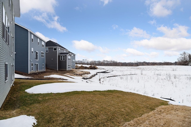 view of yard layered in snow