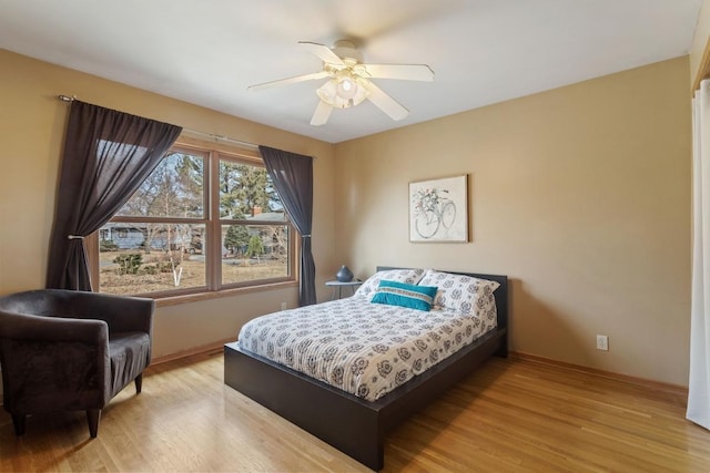 bedroom featuring ceiling fan and light wood-style floors