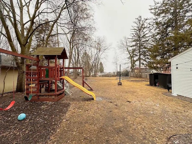 view of playground featuring fence