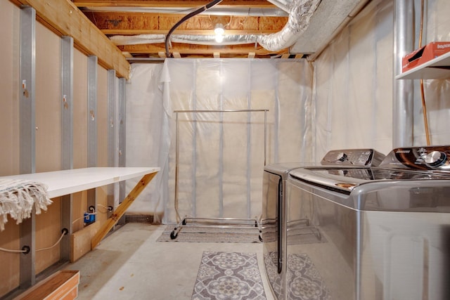 unfinished basement with washing machine and dryer