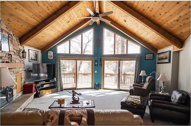 carpeted living room with wood ceiling, a fireplace, high vaulted ceiling, and beam ceiling