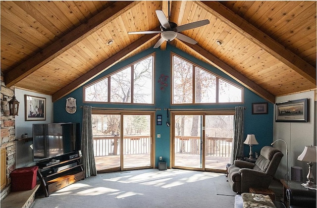 carpeted living room with a ceiling fan, wood ceiling, high vaulted ceiling, and beam ceiling