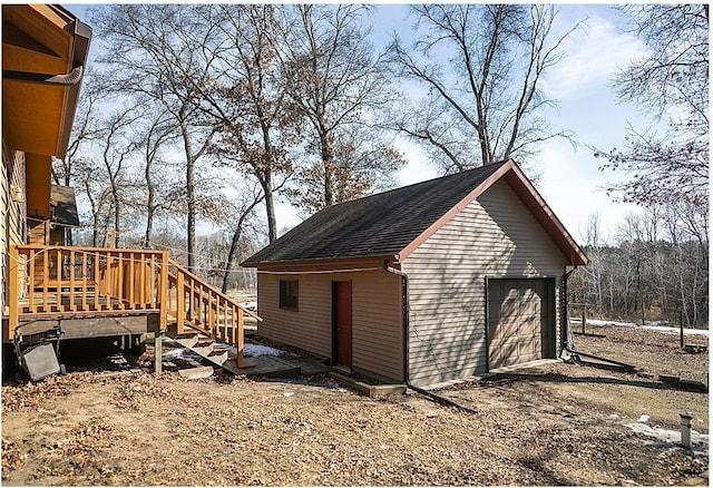 exterior space featuring an outbuilding and driveway