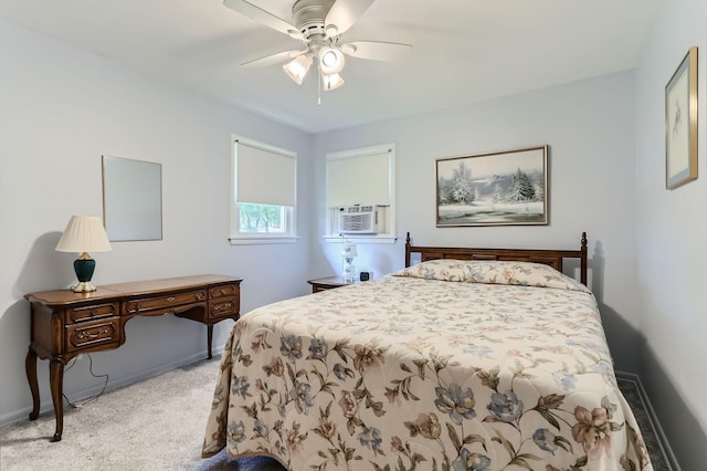 bedroom with baseboards, cooling unit, a ceiling fan, and light colored carpet