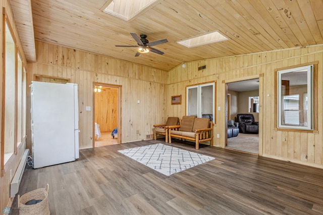 unfurnished room with a baseboard radiator, wooden ceiling, and wood finished floors